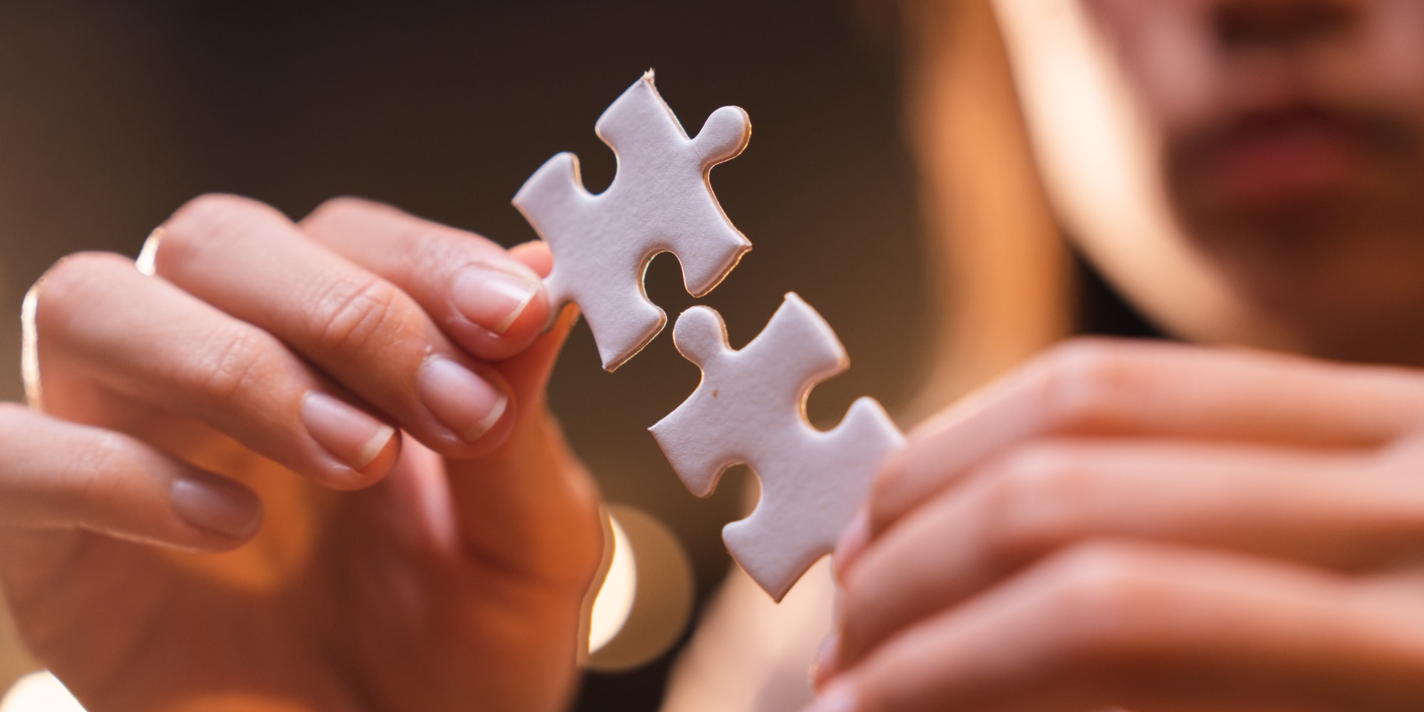 Concept of integration and startup with puzzle pieces merger with teamwork of business worker