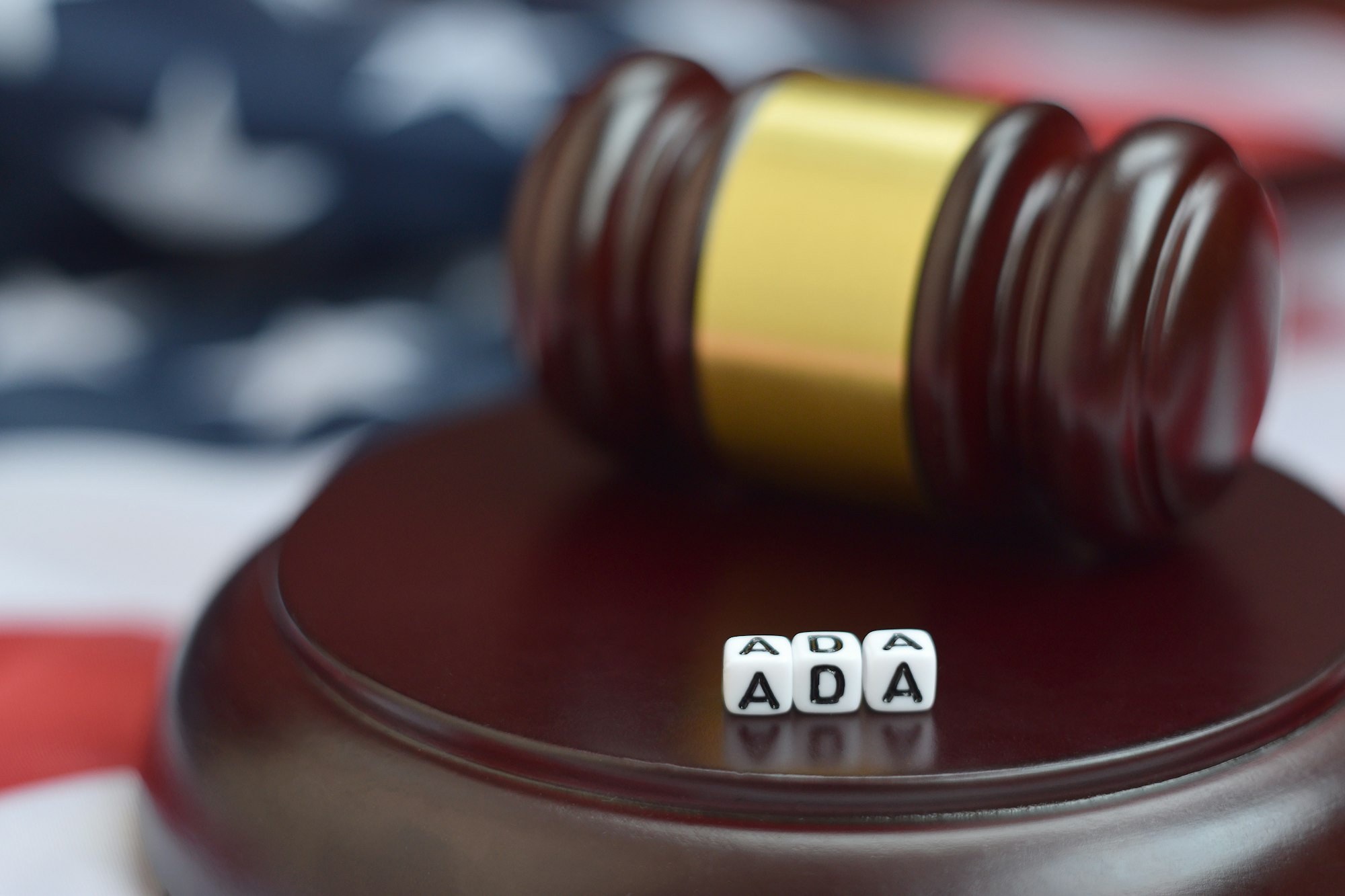 Justice mallet and ADA acronym close up. Americans with disabilities act