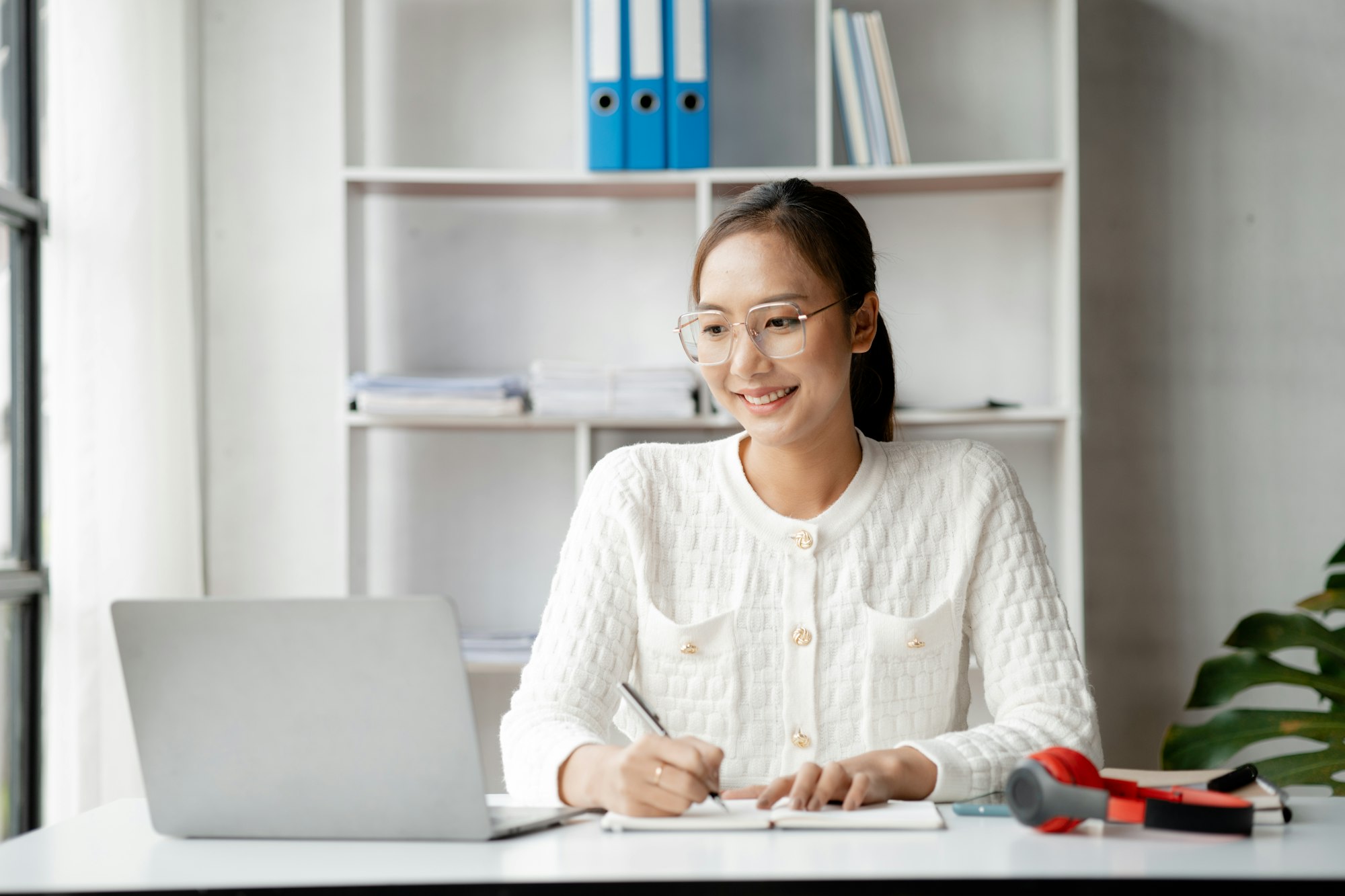 A businesswoman is checking company financial documents.