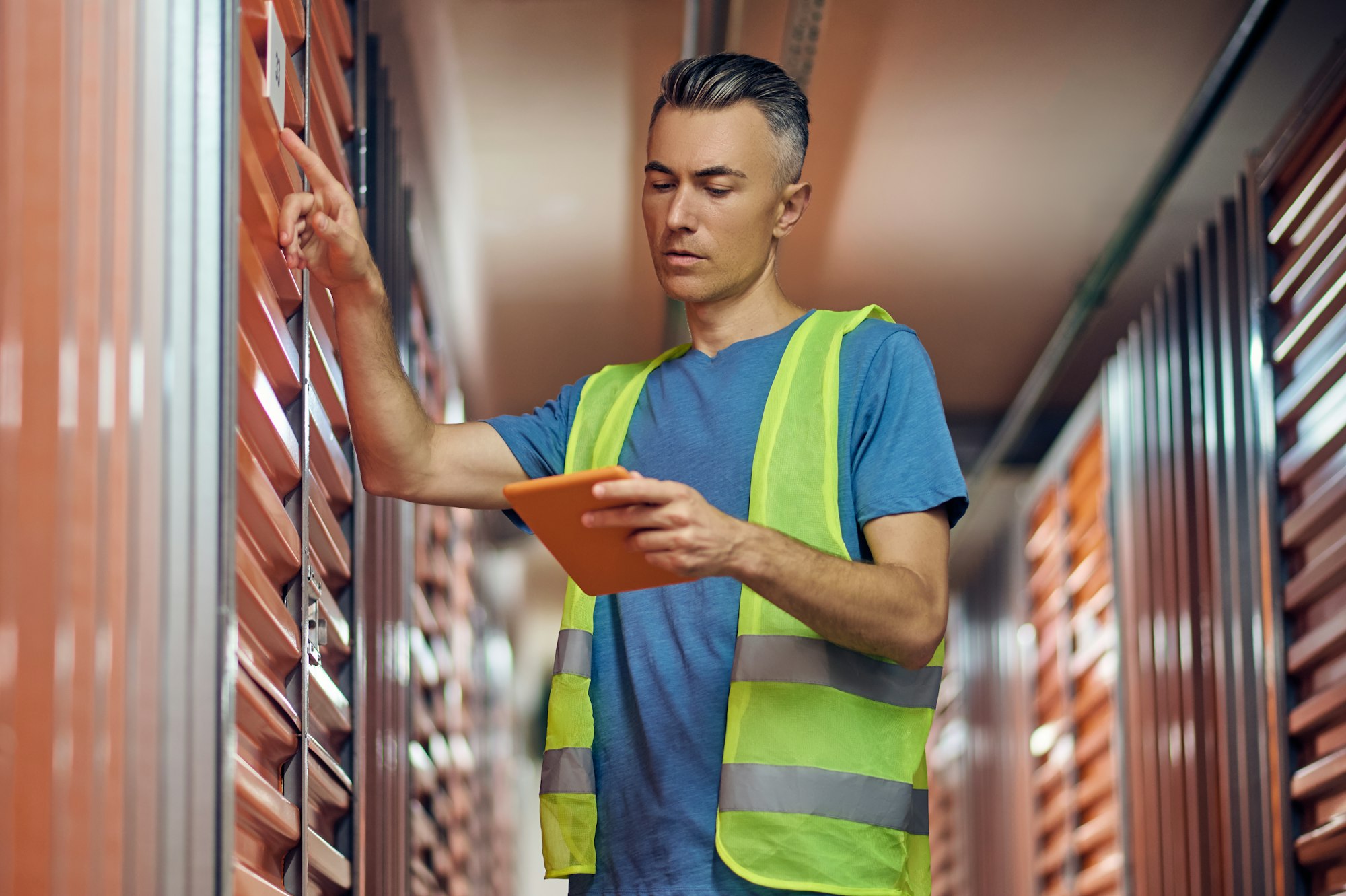 Attentive man with tablet checking data