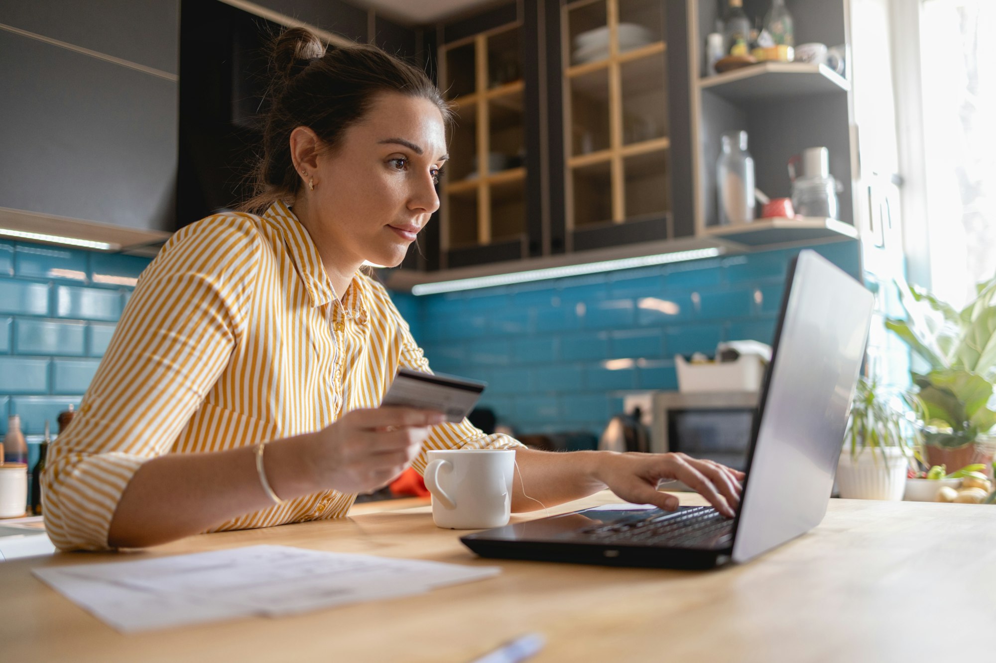 Young woman Paying Bills Online